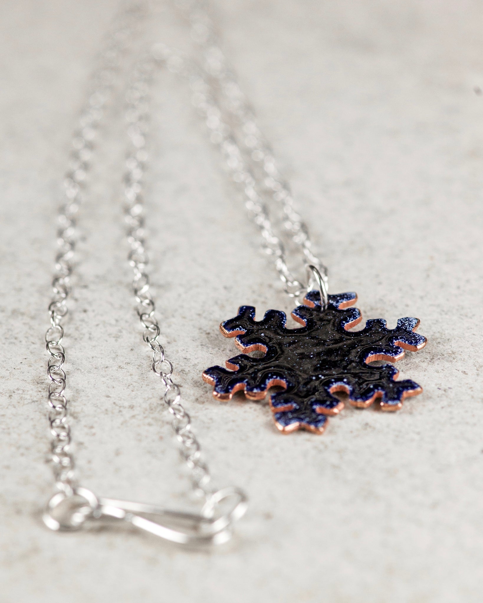 Reversible snow flake necklace